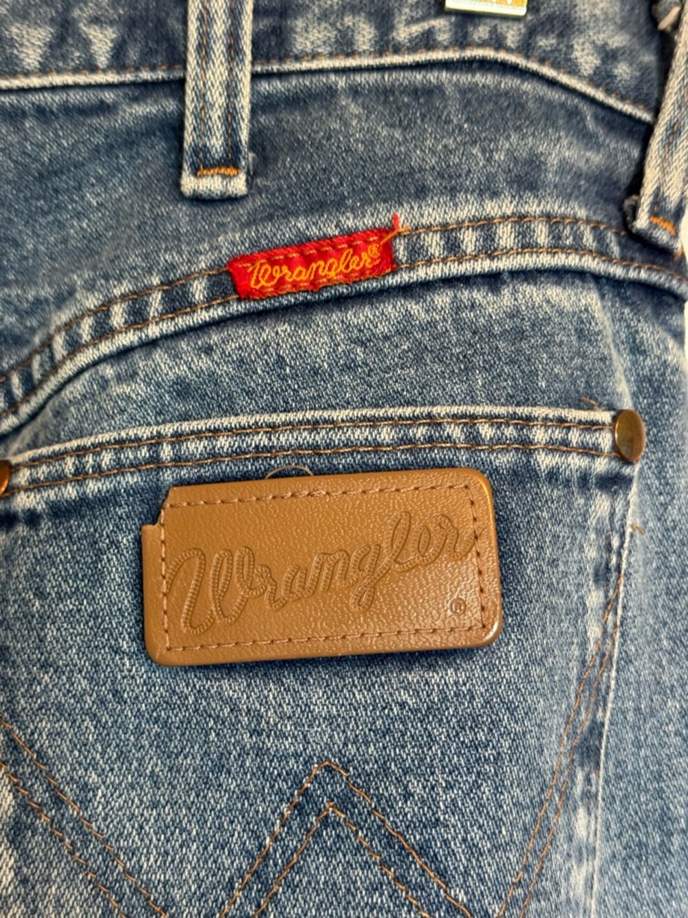 Wrangler Straight Blue Denim Jeans with Red Logo Tag and Brown Patch